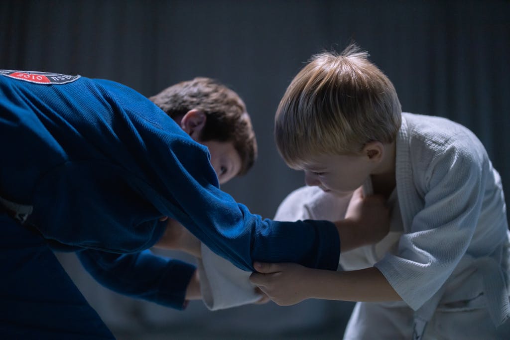 Two kids practicing Brazilian Jiu Jitsu. Combat Social Club offers Brazilian Jiu Jitsu training for kids in San Antonio, TX.