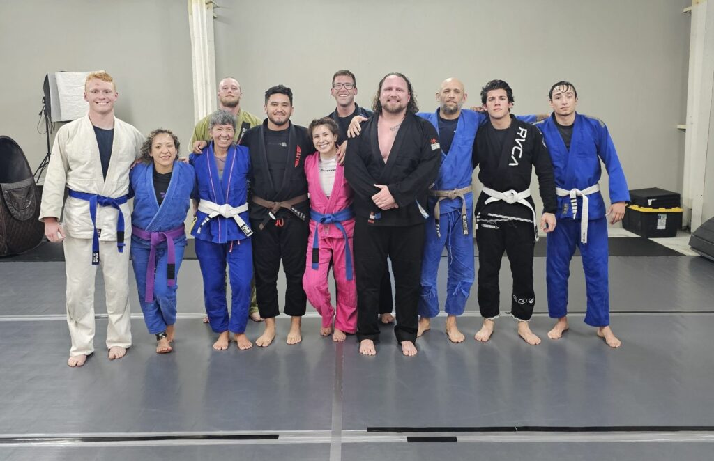 The team at Combat Social Club posing for a photo. Come train with us at Combat Social Club to train brazilian jiu jitsu, judo, and wrestling in San Antonio, TX.