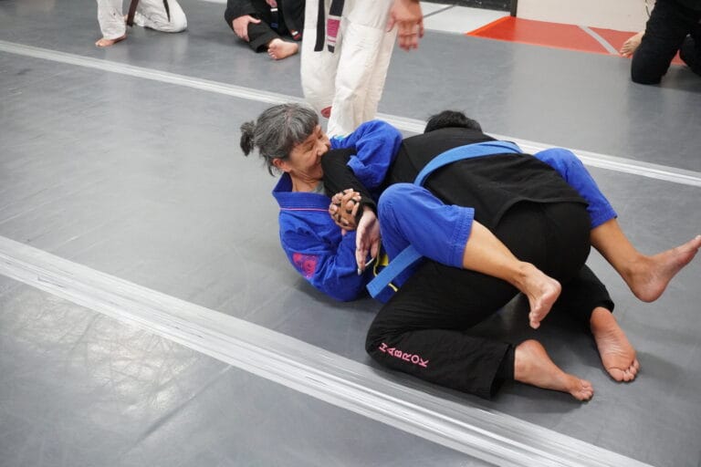 older woman doing brazilian jiu jitsu in san antonio tx
